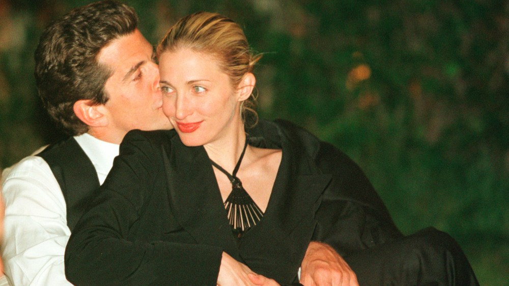 John F. Kennedy, Jr. Carolyn Bessette a kiss on the cheek during the annual White House Correspondents dinner May 1, 1999 in Washington, D.C. July 16, 2000 marks the one year anniversary of the plane crash which killed Kennedy, his wife and sister-in-law. (Photo by Tyler Mallory/Liaison)