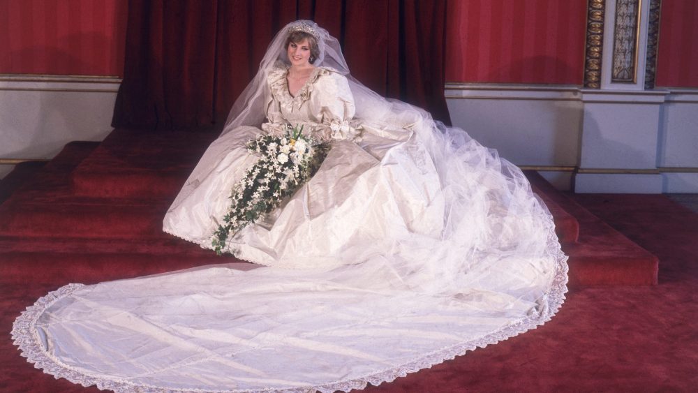 Princess Diana in her bridal gown at Buckingham Palace after her marriage to Prince Charles at St. Paul's Cathedral, royal wedding, dress
