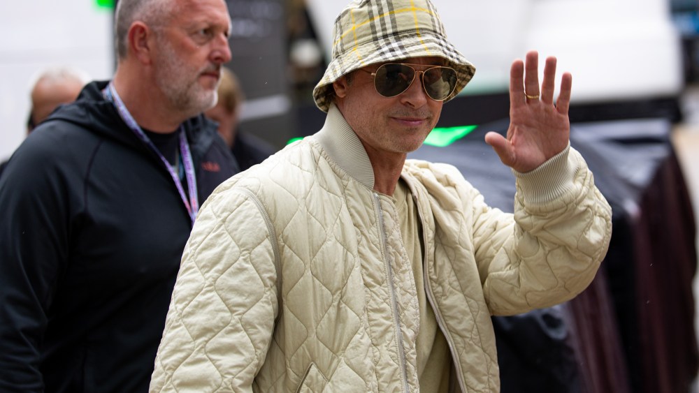 NORTHAMPTON, ENGLAND - JULY 5: Brad Pitt waves to onlookers in the F1 paddock during practice ahead of the F1 Grand Prix of Great Britain at Silverstone Circuit on July 5, 2024 in Northampton, United Kingdom. (Photo by Kym Illman/Getty Images)