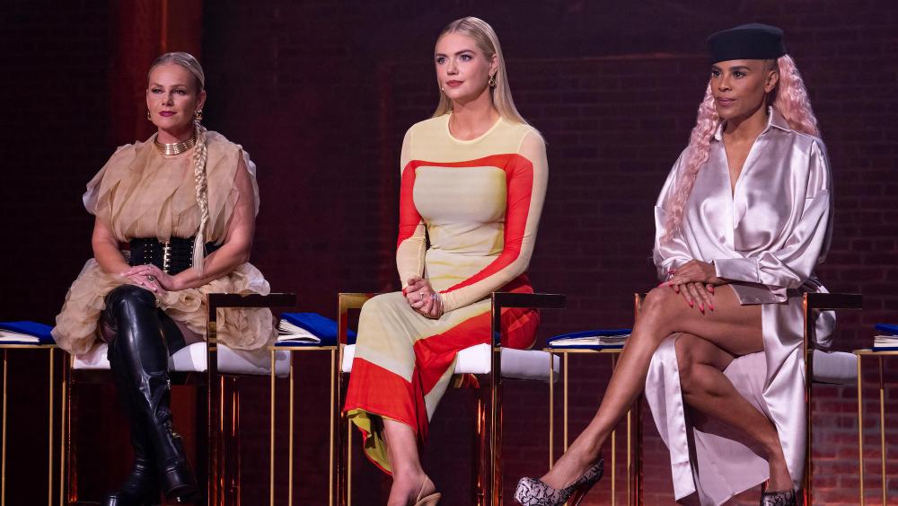 Dress My Tour -- Hosted by supermodel and actress Kate Upton, “Dress My Tour” takes fans behind the curtain of the unpredictable fashion and music industries. The series follows 11 aspiring fashion designers on the raw, emotional journey of creating stunning fashion pieces worthy of the music world’s biggest names like JoJo Siwa, Paula Abdul, Toni Braxton, Ty Dolla $ign and more. As these designers compete to make their mark in the fashion and music industries, find out which one of them truly has what it takes to design for the stars and win the $100,000 prize. Marina Toybina, Kate Upton, and Laurieann Gibson, shown. (Photo by: Kevin Estrada/Hulu)