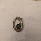 有谁知道这个别针或上面的脸吗？这枚别针属于我的曾祖母。