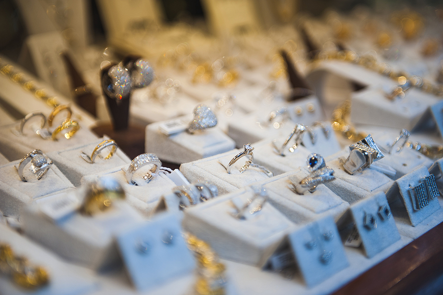 A close-up view of a jewellery store display case containing numerous items.