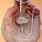 金牙项链的第一个版本 - 一系列银色的编织项链，SDL，带有23.5 km keum -boo。