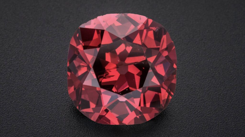 Close-up of an old mine brilliant-cut fancy red diamond.