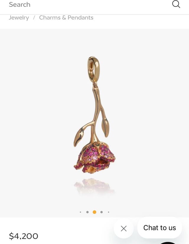 您会以这个价格购买吗？ 18黄色克拉与粉红色的蓝宝石。我是珠宝花卉设计，那很漂亮