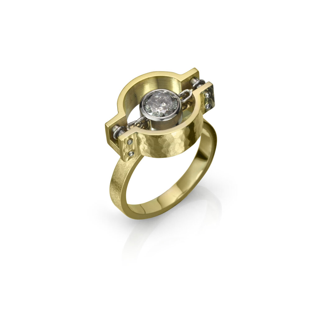 A gold ring with an open circular area and a diamond in the centre.
