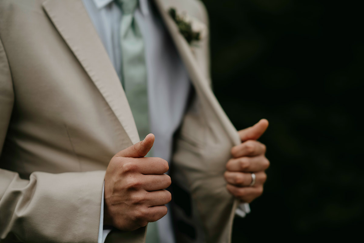 wearing a beige suit for your wedding