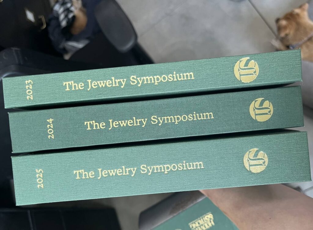 Three green hardcover books with gold lettering showing the years 2023, 2024, 2025.