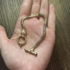 复古猫科动物图案网状手链。实心 14k 黄金，带拨动扣