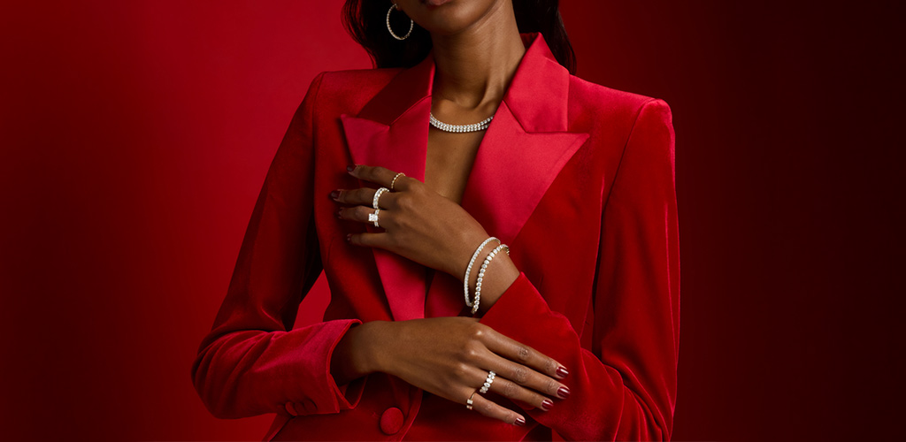 Model wearing diamond rings, bracelets and necklace styled in red for James Allen's new Valentine’s Day launch.