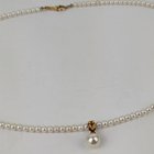 旧货拍卖中发现珍珠和 18 克拉项链