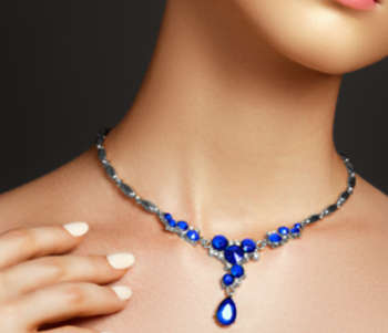 Woman wearing sapphire and gold necklace