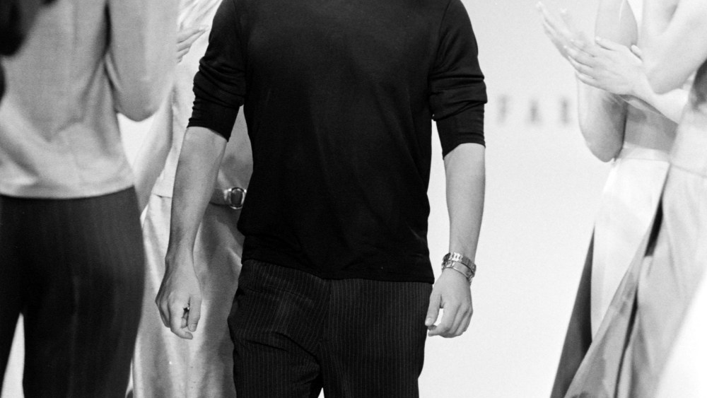 Designer Victor Alfaro takes a bow during the finale of his spring 1996 runway show