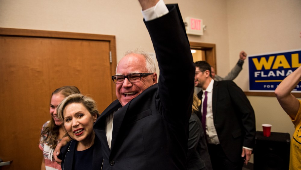 Rep. Tim Walz (D-MN) and his wife, Gwen Walz, celebrate while entering his election night party on August 14, 2018 in St Paul, Minnesota. Walz won the night's primary and will go on to be the DFL candidate for Governor in the general election.
