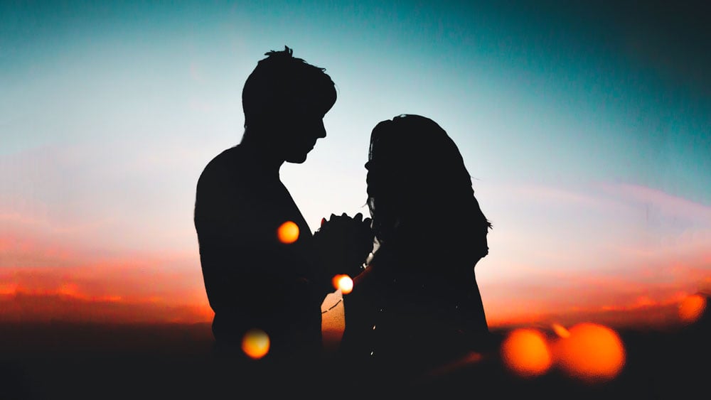 Guy Proposing to Girl in Sunset