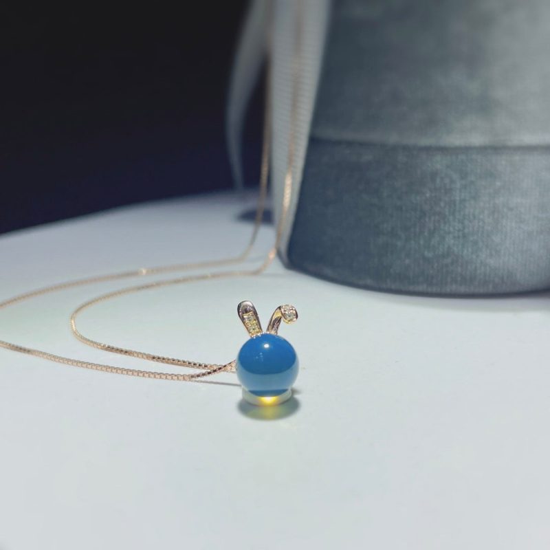 Autumn's Whisper Jewelry: 18k Gold Embedded Dominican Blue Amber Pendant with Adorable Rabbit