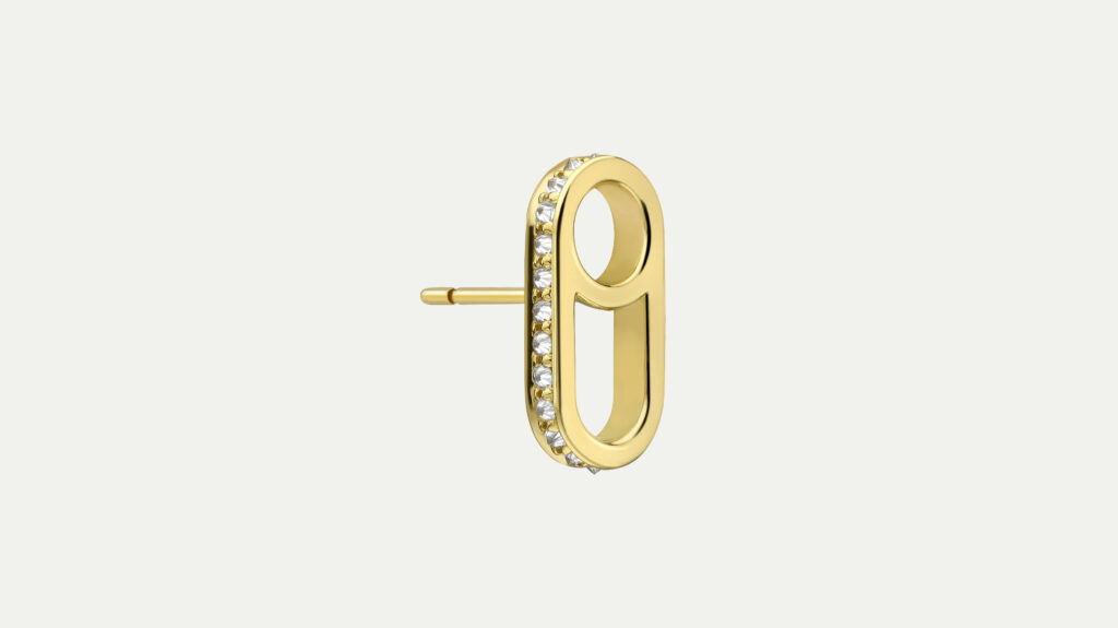 A gold oval-shaped earring encrusted with diamonds on a white background.