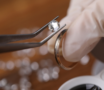 jeweler repairing diamond ring